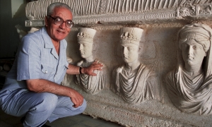 A 2002 picture of Khaled al-Asaad in front of a rare sarcophagus from Palmyra depicting two priests dating from the first century. Photograph: Marc Deville/Gamma-Rapho via Getty Images (theguardian.com) 